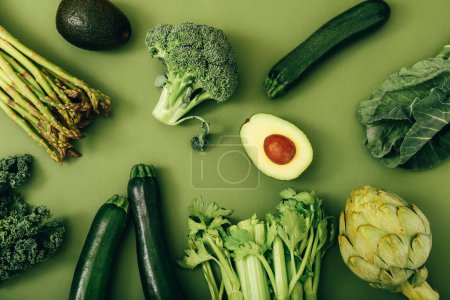 Photo for Organic healthy green vegetables on colorful background - Royalty Free Image