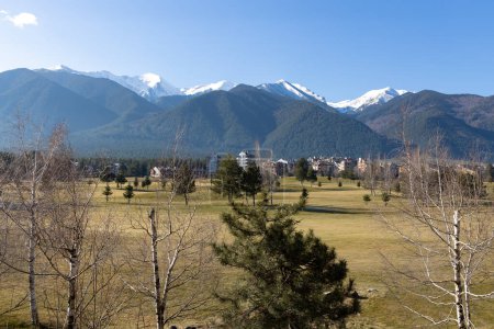 Razlog, Bulgaria, February 16, 2024. View of the Pirin golf course, the hotel area and the snowy peaks of the Pirin mountain. The terrain in the Pirin and Rila is alpine, includes trails over steep slopes.