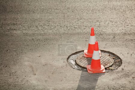 Photo for Road hazard signaling cones. on road maintenance works - Royalty Free Image