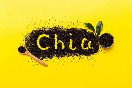 Photo for Chia word made from chia seeds top view on colored background. Healthy superfood. - Royalty Free Image