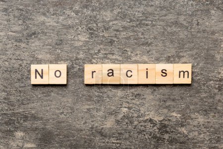 Photo for No racism word written on wood block. No racism text on table, concept. - Royalty Free Image