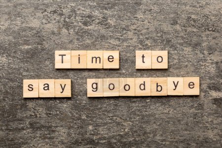 Photo for Time to say goodbye word written on wood block. Time to say goodbye text on table for your desing, concept. - Royalty Free Image