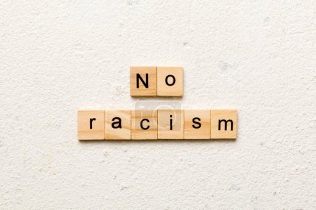 Photo for No racism word written on wood block. No racism text on table, concept. - Royalty Free Image
