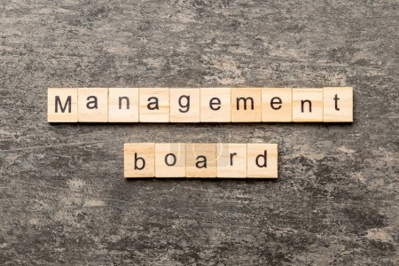 Photo for Management board word written on wood block. Management board text on cement table for your desing, concept. - Royalty Free Image