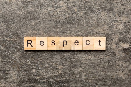 Respekt Wort auf Holzblock geschrieben. Text auf dem Tisch, Konzept respektieren.