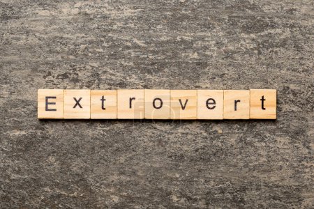 Photo for Extrovert word written on wood block. extrovert text on table, concept. - Royalty Free Image