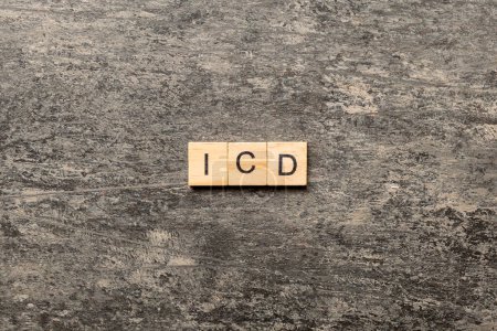 Photo for Icd word written on wood block. international classification diseases text on table, concept. - Royalty Free Image