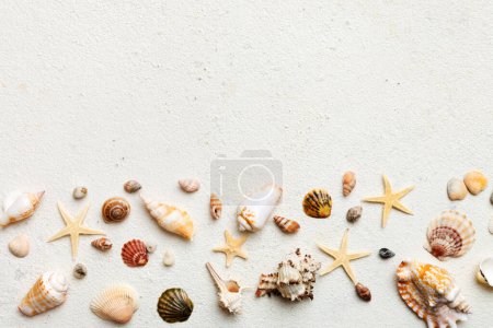 Foto de Summer time concept Flat lay composition with beautiful starfish and sea shells on colored table, top view with copy space for text. - Imagen libre de derechos