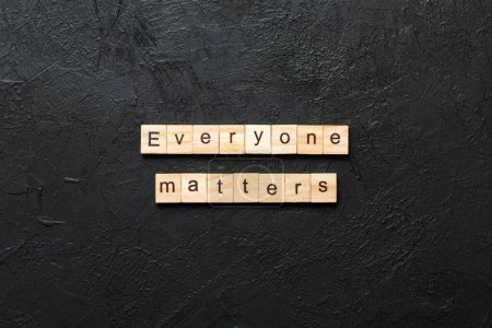 everyone matters word written on wood block. everyone matters text on table, concept.