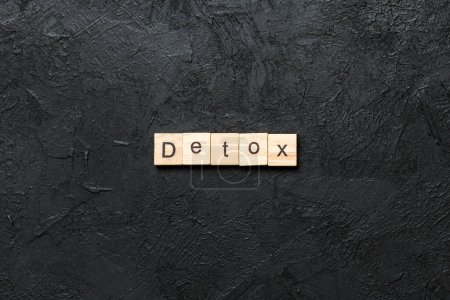 Photo for Detox word written on wood block. detox text on cement table for your desing, concept. - Royalty Free Image