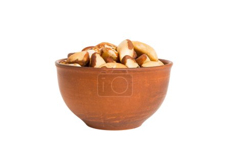Roasted Brazil nut in bowl isolated on white background. Brazil nut is snack or raw of cook. Healthy food concept.