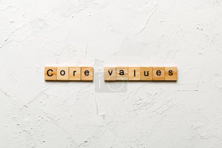 CORE VALUES word written on wood block. CORE VALUES text on cement table for your desing, concept.