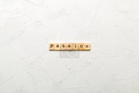 mot de passion écrit sur un bloc de bois. texte passion sur table, concept.