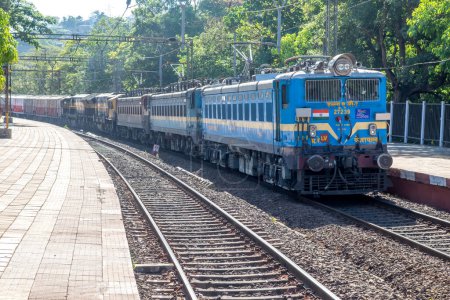 Photo for Pune, India - April 02 2023: WAG7 electric locomotive hauls a freight train near Pune India. - Royalty Free Image