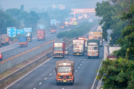 Photo for Pune, India - October 14 2023: Traffic on the Mumbai Pune Expressway near Pune India. The Expressway is officially called the Yashvantrao Chavan Expressway. - Royalty Free Image