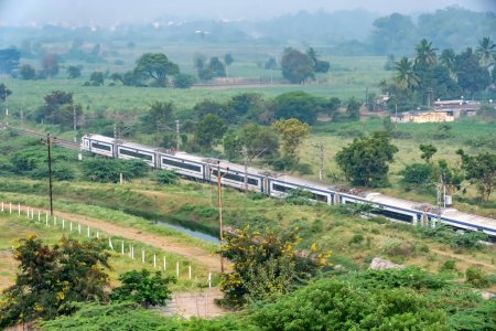 Photo for Pune, India - October 22 2023: The Solapur Mumbai Vande Bharat Express train heading towards Mumbai, near Pune India. - Royalty Free Image