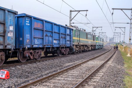 Photo for Pune, India - November 05 2023: WAG9 electric locomotive hauls a freight train near Pune India. - Royalty Free Image