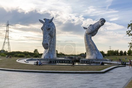 Photo for FALKIRK, SCOTHLAND 2022, August 13: The Kelpies is a 30 metre high horse head sculptures depicting kelpies, shape shifting water spirits, located between Falkirk and Grangemouth - Royalty Free Image