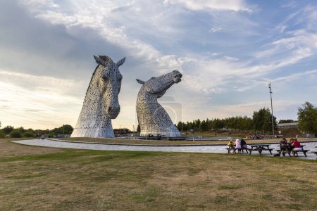 Photo for FALKIRK, SCOTHLAND 2022, August 13:  The Kelpies is a 30 metre high horse head sculptures depicting kelpies, shape shifting water spirits, located between Falkirk and Grangemouth - Royalty Free Image