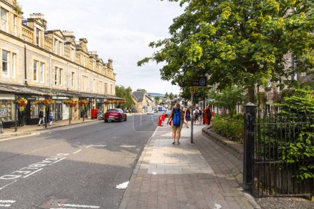 Photo for PITLOCHRY, SCOTLAND 2022, August 14: strolling in the main street of Pitlochry, Scotland - Royalty Free Image
