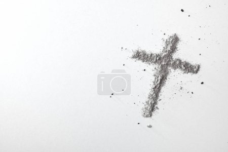 Photo for Christian cross made with ashes isolated on white table. Top view. - Royalty Free Image