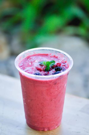 Photo for Strawberry yogurt smoothie, mixed berry smoothieor berry smoothie with berry topping - Royalty Free Image