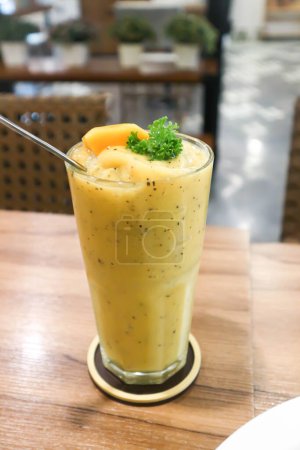 Photo for Mango smoothie or mango yogurt smoothie, mango and passion fruit smoothie with mango topping for serve - Royalty Free Image