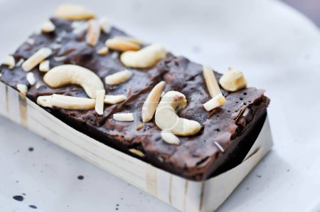 Photo for Brownie, chocolate cake or brownie with almond topping - Royalty Free Image