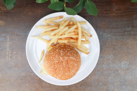 Photo for Burger or pork burger or hamburger or beef burger , bun and French fries or fried potato - Royalty Free Image
