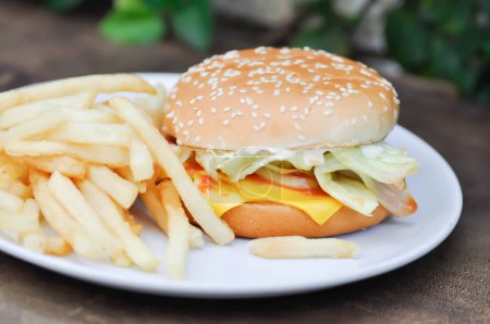 Photo for Burger or pork burger or hamburger or beef burger , bun and French fries or cheese burger - Royalty Free Image