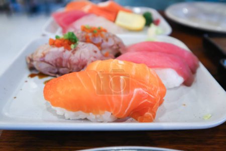 Photo for Salmon sushi or rice topped with salmon , tuna sushi and beef sushi or Japanese food - Royalty Free Image