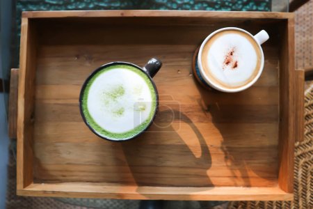 hot cofffee, cappuccino coffee or latte coffee and hot green tea or hot matcha green tea latte  in the tray
