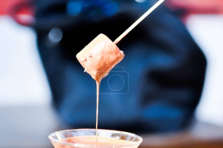 fondue,fonduta or chocolate fondue or chocolate fonduta and marshmallow for serve