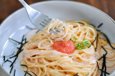 Photo for Pasta or spaghetti, mentaiko cream sauce spaghetti or mentaiko cream sauce pasta with seaweed - Royalty Free Image