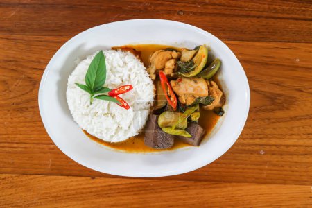 chicken curry , yellow curry chicken or chicken soup or chicken and blood jelly soup with rice or yellow curry soup
