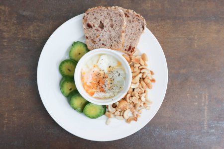 bread , whole wheat bread or sourdough bread with nuts and soft boiled egg for serve