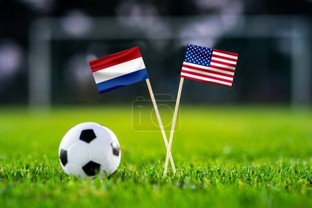 Photo for Netherlands - United States of America. Eight final, Last 16 football match. Handmade national flags and soccer ball on green grass. Football stadium in background. Black space. USA soccer match - Royalty Free Image