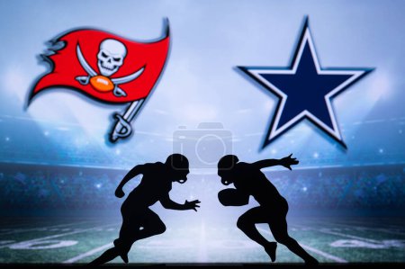 Foto de TAMPA BAY, USA, JANUARY 10, 2023: Dallas Cowboys vs. Tampa Bay Buccaneers. NFL Wild Card Round 2023, Silhouette of two NFL American Football Players against each other. Big screen in background - Imagen libre de derechos