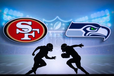 Téléchargez les photos : SAN FRANCISCO, USA, JANUARY 10, 2023: Seattle Seahawks vs. San Francisco 49ers. NFL Wild Card Round 2023, Silhouette of two NFL American Football Players against each other. Big screen in background - en image libre de droit