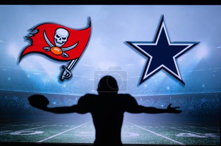 Téléchargez les photos : TAMPA BAY, USA, JANUARY 10, 2023: Dallas Cowboys vs. Tampa Bay Buccaneers. NFL Wild Card Round 2023, Silhouette of NFL player of american football. holding ball in hand. Big screen in background - en image libre de droit
