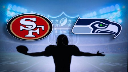 Photo for SAN FRANCISCO, USA, JANUARY 10, 2023: Seattle Seahawks vs. San Francisco 49ers. NFL Wild Card Round 2023, Silhouette of NFL player of american football. holding ball in hand. Big screen in background - Royalty Free Image
