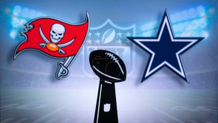 Photo for TAMPA BAY, USA, JANUARY 10, 2023: Dallas Cowboys vs. Tampa Bay Buccaneers. NFL Wild Card Round 2023, Silhouette of Vince Lombardi Trophy for the winner of National Football League. Big screen - Royalty Free Image
