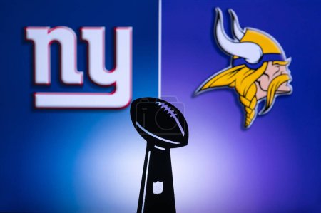 Photo for MINNESOTA, USA, JANUARY 10, 2023: New York Giants vs. Minnesota Vikings. NFL Wild Card Round 2023, Silhouette of Vince Lombardi Trophy for the winner of National Football League. Big screen - Royalty Free Image