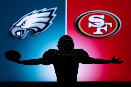Photo for PHILADELPHIA, USA, JANUARY 18, 2023: San Francisco 49ers vs. Philadelphia Eagles. NFL Conference Championship. Player with open arms. Teams logo on big screen in background - Royalty Free Image