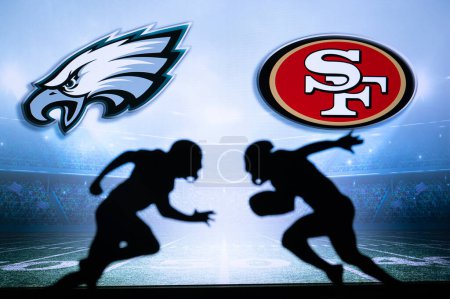 Photo for PHILADELPHIA, USA, JANUARY 18, 2023: San Francisco 49ers vs. Philadelphia Eagles. NFL Conference Championship. silhouette of two players in game. NFC Finals - Royalty Free Image
