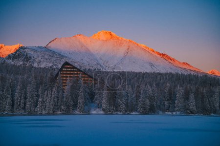 Photo for The High Tatras and Strbske pleso lake in all its frozen splendor, bathed in the light of a winter sunrise - Royalty Free Image