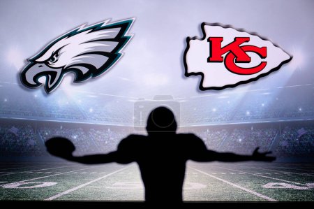 Photo for PHOENIX, USA, 30 JANUARY 3, 2023: Philadelphia Eagles vs. Kansas City Chiefs. Silhouette of NFL player of american football. holding ball in hand. Big screen in background - Royalty Free Image