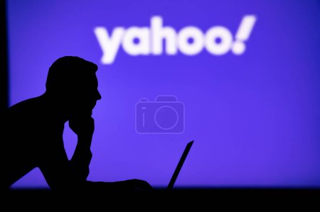 Photo for INDIA, NEW DELHI. JANUARY 30, 2023: Yahoo. Unleashing the Power of the Internet: Silhouetted Man Uses Innovative App to Browse - Royalty Free Image