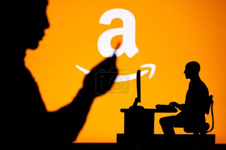 Photo for USA, SEATTLE, JANUARY 30, 2023: Amazon. The Intersection of Personal and Professional: Silhouette of Man and Web Developer - Royalty Free Image