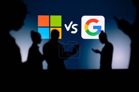 Photo for UK, LONDON. JANUARY 30, 2023: Microsoft vs Google. Innovating Together: Silhouetted Web Developers Uniting for Progress with Company Logo in Background - Royalty Free Image